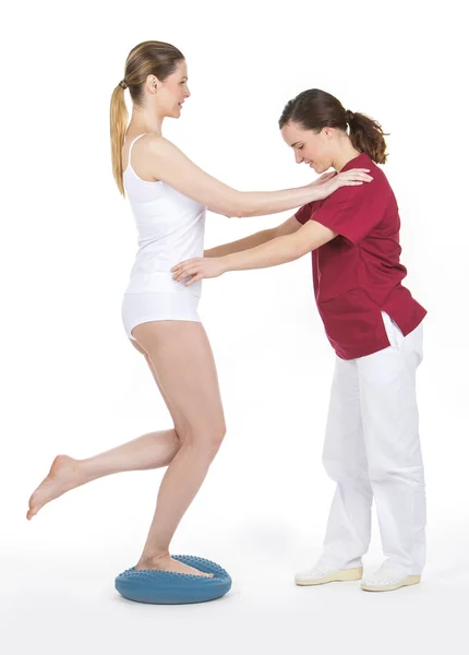 Woman with physiotherapist — Stock Photo, Image