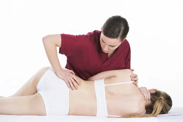 Physical therapist which makes spinal mobilization — Stock Photo, Image