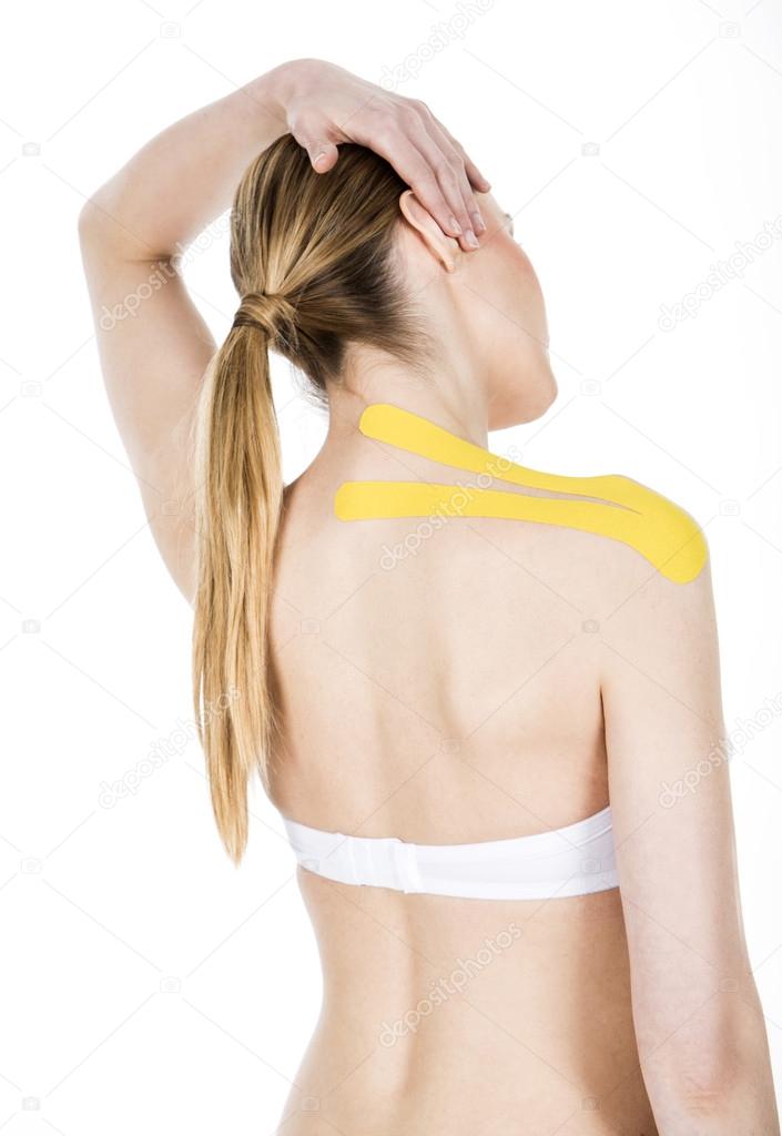 Woman with tape on the neck shoulder