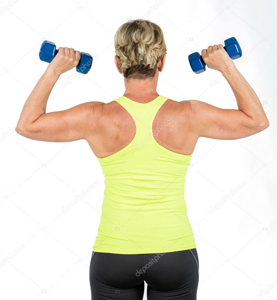 woman doing arms exercises with dumbbell
