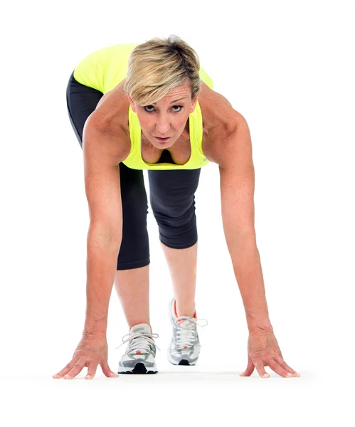 Fitness middelbare leeftijd vrouw in een beginpositie — Stockfoto