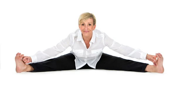 Manager woman doing yoga at white background Stock Picture