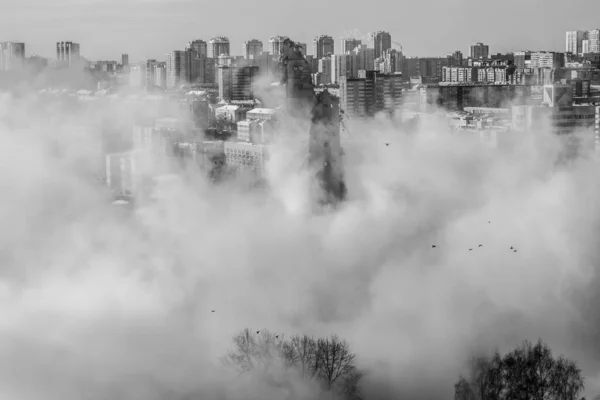 The blown-up TV tower is shrouded in dust. Black and white photo | YEKATERINBURG, RUSSIA - 24 MARCH 2018.