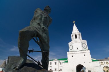 Monument to Musa Jalil and Spasskaya tower of the Kazan Kremlin. clipart