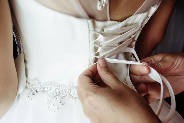 Corset of happy blonde bride — Stock Photo, Image