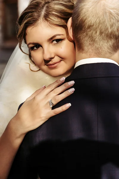 Happy blonde bride and handsome groom — Stock Photo, Image