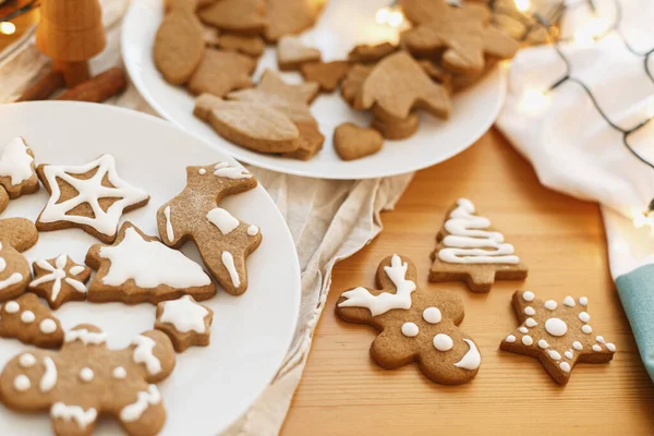 Gingerbread Cookies Icing White Plate Wooden Table Festive Lights Decorated — Stock Photo, Image