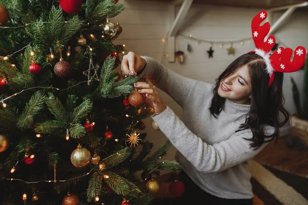 Happy Young Woman Reindeer Antlers Decorating Modern Christmas Tree Golden — Stock Photo, Image