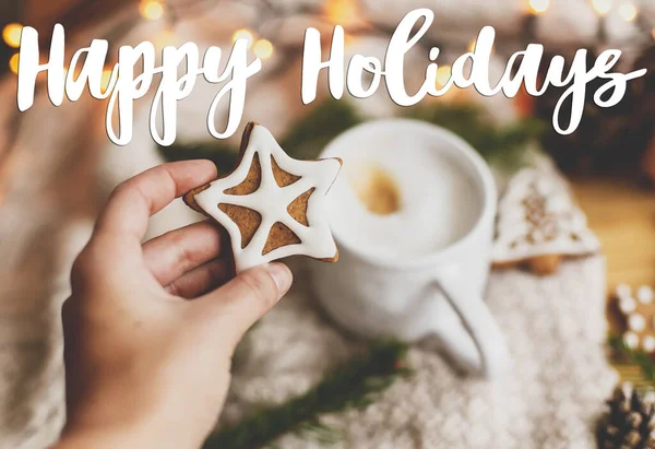 Happy Holidays Text Handwritten Hand Holding Christmas Star Gingerbread Cookie — Stockfoto
