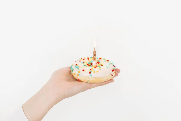 Happy Birthday Hand Holding Delicious Birthday Donut Candle Background White — Fotografia de Stock