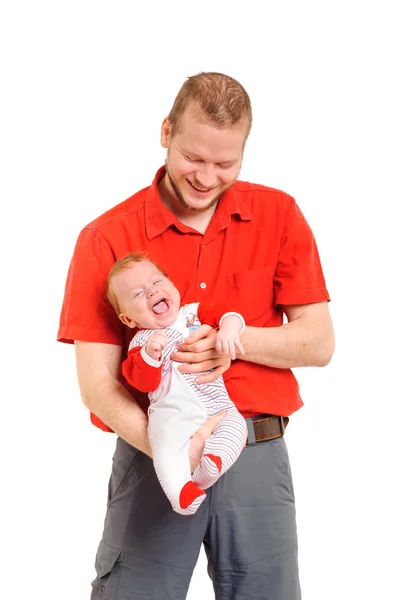 Padre sosteniendo a su hijo en las manos — Foto de Stock