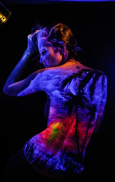 Girl with landscape bodyart in blacklight — Stock Photo, Image