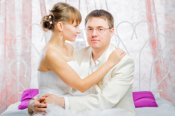 Bride and groom in wedding studio Stock Picture