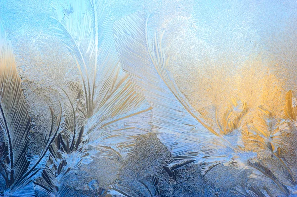 Window glass covered with ice pattern — Stock Photo, Image