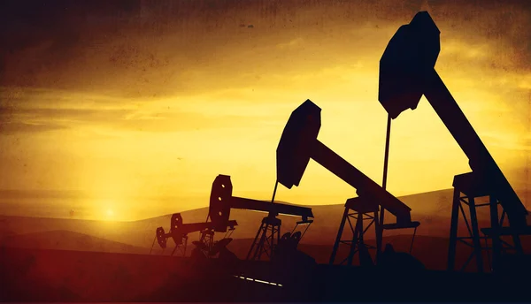 3D illustration av olja pump knektar på sunset — Stockfoto