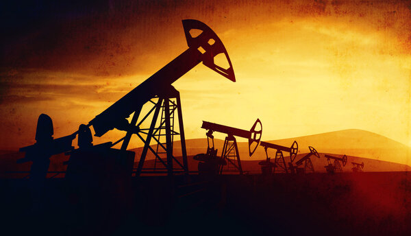 3d illustration of oil pump jacks on sunset background