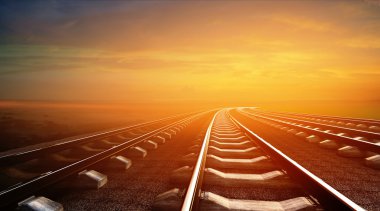 empty railways on sunset sky background clipart