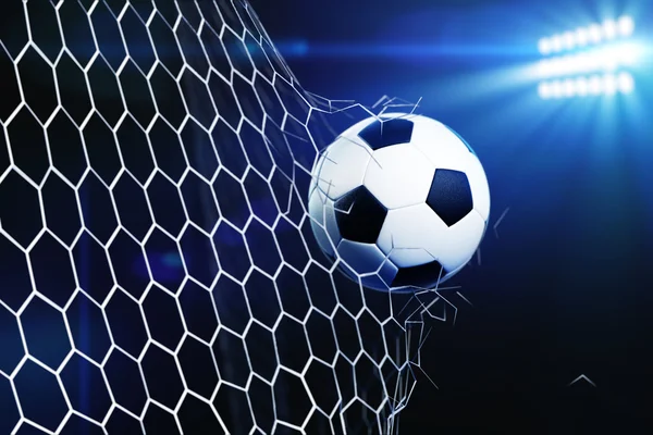 Soccer ball breaking goal net — Stock Photo, Image
