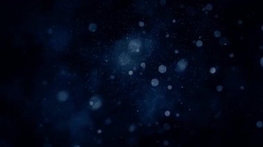 Uçan ve titreşen parçacıkların ışık demeti olarak canlandırıldığı soyut bir arkaplan. Kusursuz döngünün animasyonu. Toz baloncukları kar animasyonu..