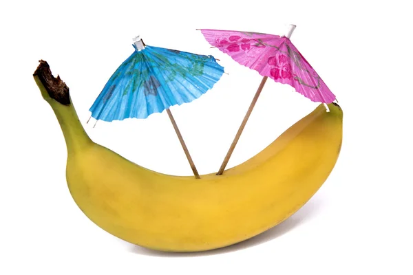 Банан с красочными зонтиками — стоковое фото