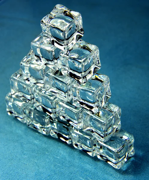 Ice cubes over blue. — Stock Photo, Image