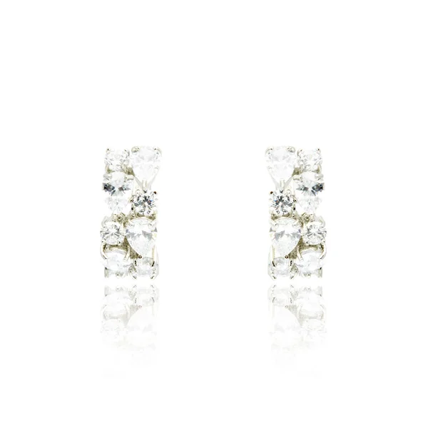 Pair of silver diamond earrings isolated on white — Stock Photo, Image