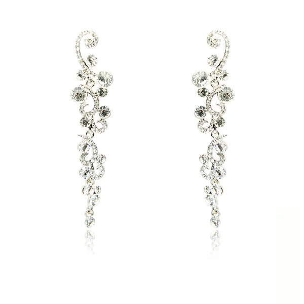 Pair of silver diamond earrings isolated on white — Stock Photo, Image