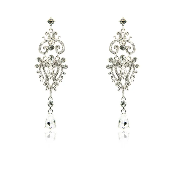 Pair of silver diamond earrings isolated on white — Stock Photo, Image