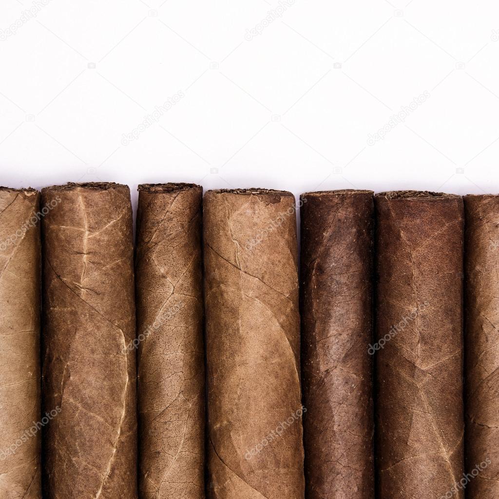 Cigars in a row with space for text.
