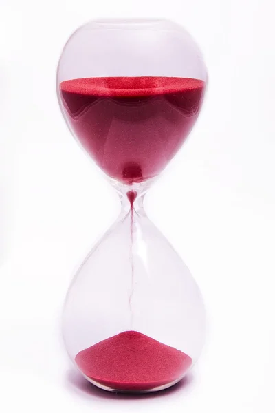 Red hourglass on white background. — Stock Photo, Image