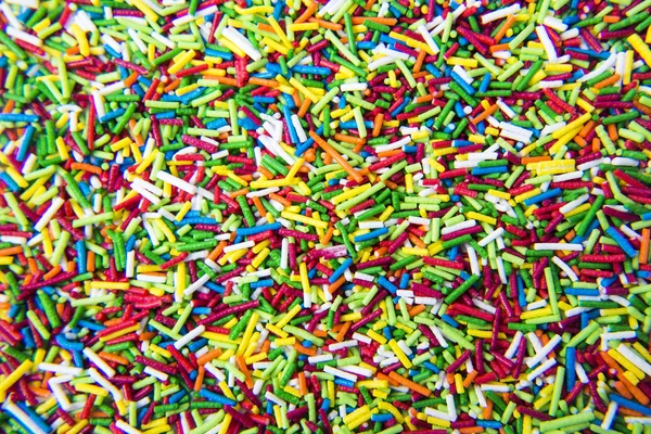 Renkli şeker karışımı toz arka plan sopa — Stok fotoğraf