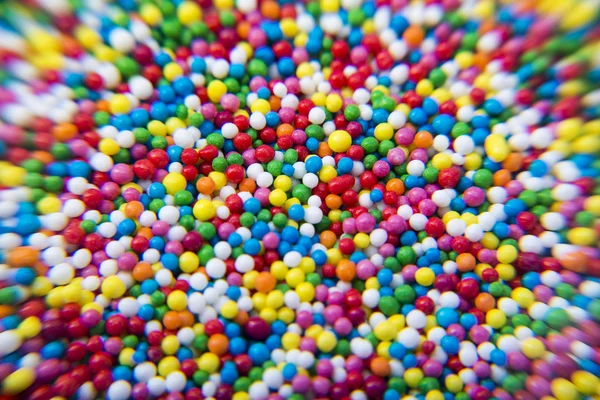 Makro şeker renkli toplar toz arka plan — Stok fotoğraf