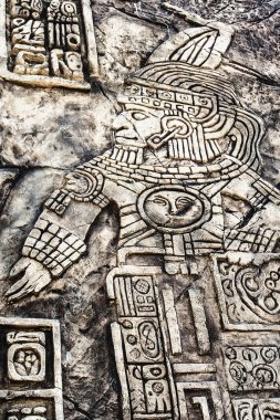 Ancient Mayan hieroglyphics in stone clipart