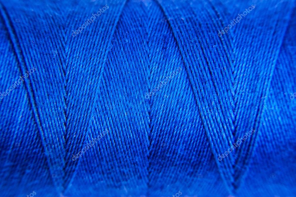 Blue Sewing thread background Stock Photo by ©Art_of_Life 79493776