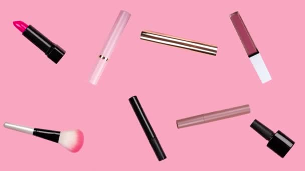 Different makeup accessories rotate on trendy pastel pink background. Beauty animation. Cosmetic products. Make-up tools set concept. Lipstick, mascara, brush, nail Polish move. Skin care. Sale. — Stock Video