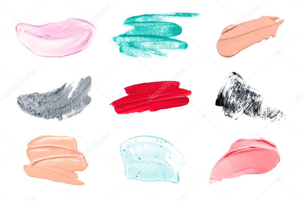 Set different cosmetic smears on white background isolated. Hyaluronic acid, serum, Foundation, mascara, lipstick.