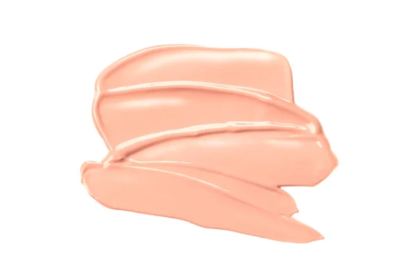 Esfregaço bege claro de fundação cremosa no fundo branco. Uma mancha cor-de-rosa. Maquiagem. Produtos cosméticos. — Fotografia de Stock