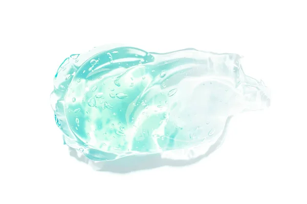 Διαφανής μπλε ορός προσώπου υγρασία, ζελέ μαλλιών με φυσαλίδες πασαλειμμένες σε λευκό φόντο. Καλλυντικά προϊόντα για περιποίηση δέρματος Εικόνα Αρχείου