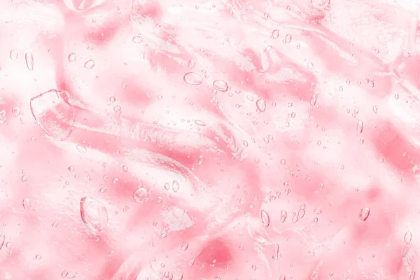 Productos cosméticos para maquillaje y cuidado de la piel. Humedad rosa transparente cara suero manchado. Gel antibacteriano con burbujas — Foto de Stock
