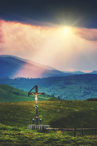 Cross with crucifix on a hil — Stock Photo, Image