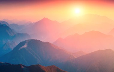 Great sunrise in mountains clipart