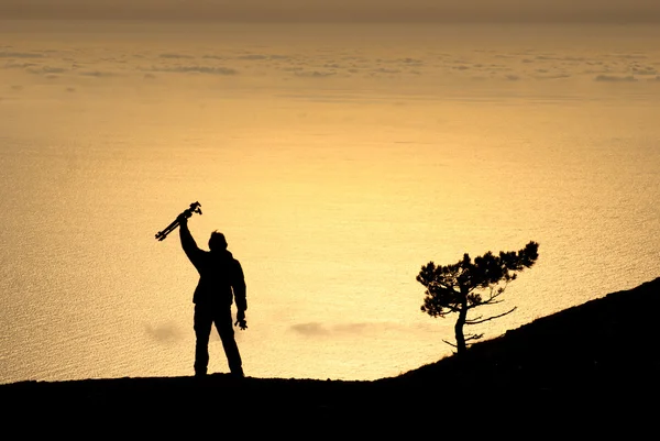 Photographer silhouette with  tripod — Stock Photo, Image