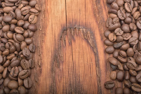 Fond de grain de café sur texture bois — Photo