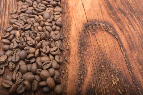 Fond de grain de café sur texture bois — Photo