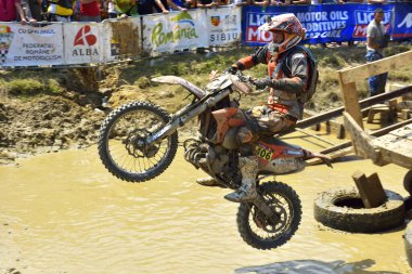 SIBIU, ROMANIA - JULY 16: A competitor in Red Bull ROMANIACS Hard Enduro Rally with a KTM motorcycle. The hardest enduro rally in the world. July 12-16, 2016 in Sibiu, Romania.