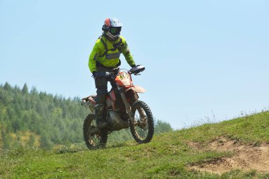 SIBIU, ROMANIA - JULY 16: A competitor in Red Bull ROMANIACS Hard Enduro Rally with a KTM motorcycle. The hardest enduro rally in the world. July 12-16, 2016 in Sibiu, Romania.