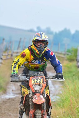 SIBIU, ROMANIA - JULY 16: A competitor in Red Bull ROMANIACS Hard Enduro Rally with a KTM motorcycle. The hardest enduro rally in the world. July 12-16, 2016 in Sibiu, Romania.