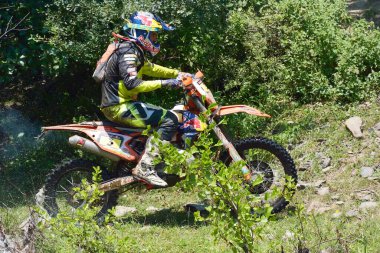 SIBIU, ROMANIA - JULY 16: A competitor in Red Bull ROMANIACS Hard Enduro Rally with a KTM motorcycle. The hardest enduro rally in the world. July 12-16, 2016 in Sibiu, Romania.