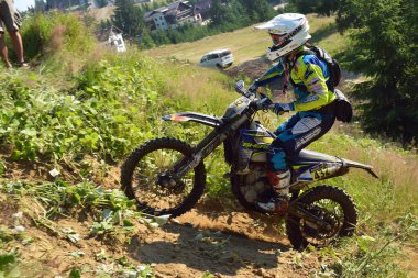SIBIU, ROMANIA - JULY 16: A competitor in Red Bull ROMANIACS Hard Enduro Rally with a KTM motorcycle. The hardest enduro rally in the world. July 12-16, 2016 in Sibiu, Romania.