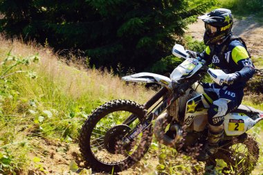 SIBIU, ROMANIA - JULY 16: A competitor in Red Bull ROMANIACS Hard Enduro Rally with a KTM motorcycle. The hardest enduro rally in the world. July 12-16, 2016 in Sibiu, Romania.